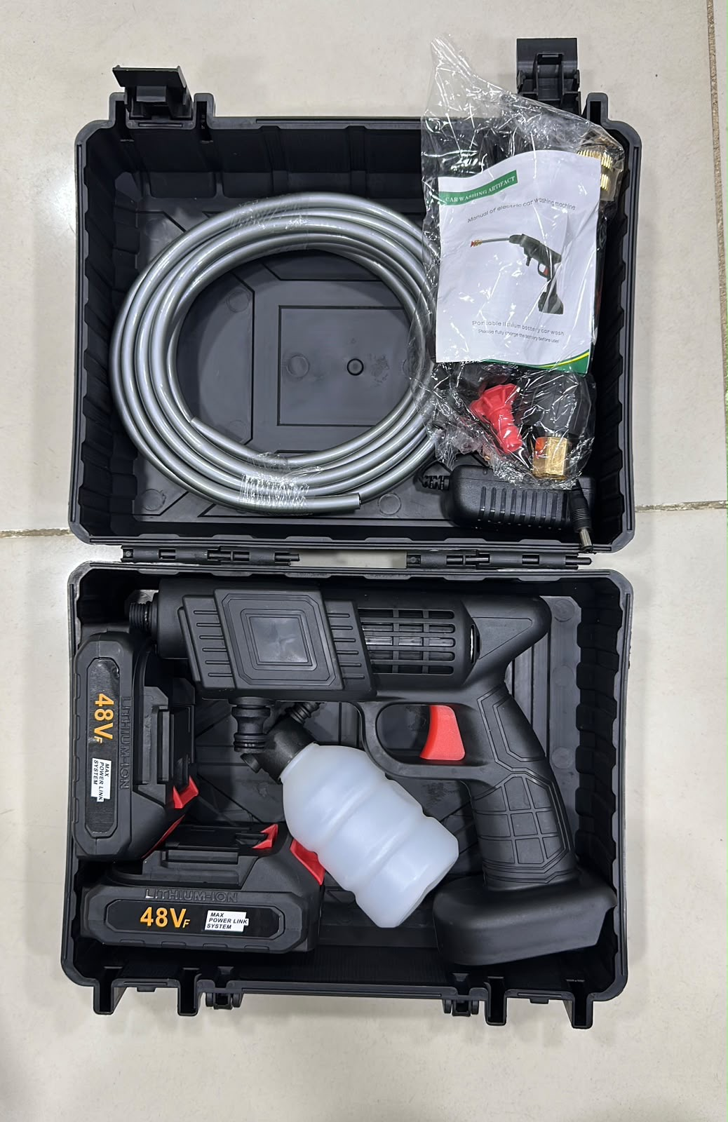 Complete box contents - gun, batteries, hose, nozzles